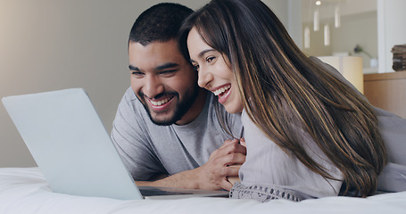 Image showing Happy, couple and watching movie on laptop in bedroom for online subscription, media download or relax together. Young man, woman and computer technology for streaming, internet or connection at home