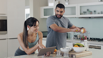 Image showing Health smoothie, couple and tablet with recipe with nutritionist fruit, healthy food and smile at home. Nutrition, breakfast and web of a woman and man together with juice blender and diet in kitchen
