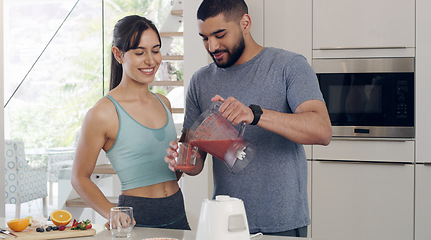 Image showing Health smoothie, couple and fitness nutritionist with fruit, healthy food and smile at home. Nutrition, breakfast and diet of a woman and man together with juice blender and happiness from cooking