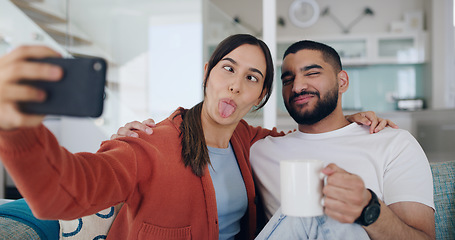 Image showing Home, selfie and couple with crazy face on sofa for social media post, online vlog and internet. Dating, love and happy man and woman take funny picture for update, emoji and relax in living room