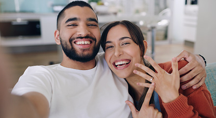 Image showing Couple, selfie and engagement ring in living room portrait for happiness, romance and love on social media app. Man, woman and excited for marriage proposal, offer and celebration with smile on blog