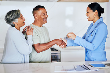 Image showing Senior couple, real estate and keys with handshake, agent or new home with congratulations on deal. Excited man, women and realtor for agreement, property or sale with smile, retirement or investment