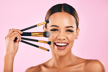 Image showing Happy woman, portrait smile and makeup brushes for beauty cosmetics against a pink studio background. Isolated female person or model smiling in satisfaction for cosmetic tools, grooming or facial