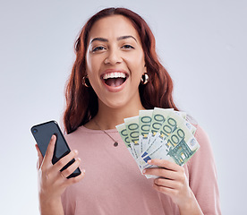 Image showing Woman, money and phone in studio portrait, winning and happy with online gambling by white background. Excited girl, smartphone or cash fan with smile for fintech app, digital casino or crypto profit