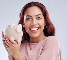 Image showing Smile, portrait or happy woman with a piggy bank for financial wealth or savings on white background. Finance, investment or girl smiling or investing cash or budget in tin for safety or security