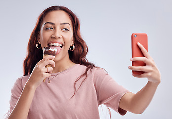 Image showing Woman, ice cream and selfie with smile in studio for summer vacation, social media app and blog by white background. Girl, gelato or dessert with photography, profile picture and happy by backdrop