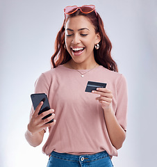 Image showing Finance, phone or excited girl with credit card for online investment on digital fintech or web in studio. Financial mobile app, ecommerce payment or happy gen z woman typing banking data on internet
