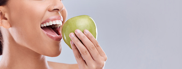 Image showing Mockup, apple bite or woman eating in studio on white background for healthy nutrition or clean diet. Closeup, space on banner or open mouth of hungry girl marketing natural green fruit for wellness