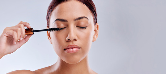 Image showing Eyelash extension, mockup or girl with mascara makeup, cosmetics or product brush for grooming in studio. Beauty, mock up space or beautiful woman with eyelashes tool for make up on white background