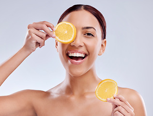 Image showing Skincare, portrait or happy woman with orange or natural facial with citrus or vitamin c for wellness. Studio background, smile or healthy girl smiling with organic fruits for dermatology beauty