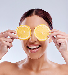 Image showing Skincare, mockup or happy girl with orange as natural facial with citrus or vitamin c for wellness. Studio background, smile or healthy female model smiling with organic fruits for dermatology beauty