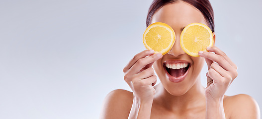 Image showing Skincare, mockup or happy woman with orange as natural facial with citrus or vitamin c for wellness. Studio background, smile or healthy girl model smiling with organic fruits for dermatology beauty