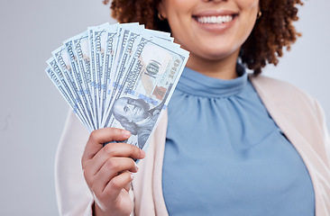 Image showing Money, fan and happy woman hands isolated on a studio background for winning, cash success or finance loan. Lottery, bank and business person or winner investment bonus, lottery or financial freedom