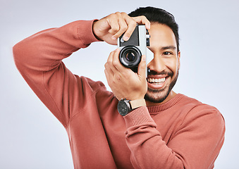 Image showing Man with camera, photography and smile in portrait with creativity and art isolated on studio background. Happy male photographer, creative with artistic person and taking pictures with gadget