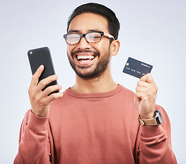 Image showing Man is laugh, smartphone and credit card for online shopping, happy with discount or promo on studio background. Positive customer experience, ecommerce and fintech, funny with male person and sale