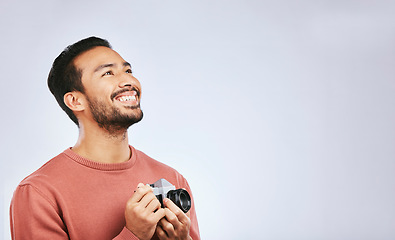 Image showing Man with camera, photography and view with creativity, mockup space and art isolated on studio background. Happy male photographer, creative with artistic person smile and taking pictures with gadget