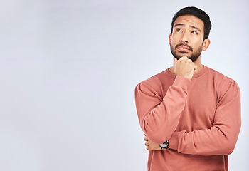 Image showing Man, thinking and idea mockup in studio or planning, decision and choice with white background. Asian male, model and curious face with doubt, questions or confused guy try to remember with space