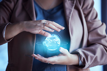 Image showing Woman, hands and hologram earth in night at office for global network, communication and digital transformation. Female IT expert, 3d holographic world and cloud computing in dark workplace with ux