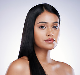 Image showing Hair care, beauty and portrait of serious woman with long hairstyle and luxury salon treatment on white background. Growth, straight haircut and face of latino model from Brazil on studio backdrop.