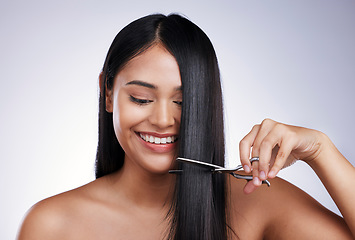 Image showing Hair care, smile and woman with scissors in studio, long hairstyle or luxury keratin treatment on white background in Brazil. Beauty, healthy haircut and happy latino model with salon cut on backdrop