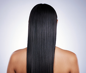 Image showing Back, hair care and woman with shine, salon and confident girl against a studio background. Female person, cosmetics or model with treatment, grooming or healthy scalp with luxury, glow and self care