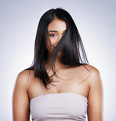Image showing Hair in face, beauty and portrait of woman with long hair, smile and luxury salon treatment on white background in Brazil. Style, makeup and latino model with straight hairstyle on studio backdrop.
