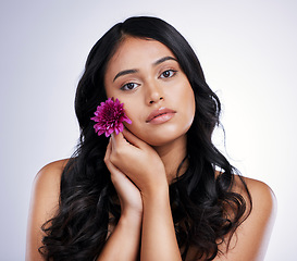 Image showing Hair care, beauty and portrait of woman with flower, natural makeup and luxury salon treatment on white background. Nature, hairstyle and flowers, latino model with floral haircare on studio backdrop