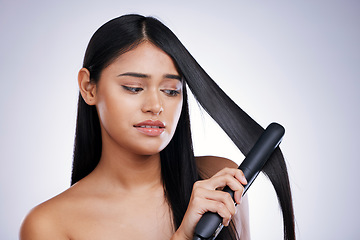 Image showing Hair, worry and unhappy woman with straightener for straight hairstyle, salon treatment and white background in Brazil. Beauty, heat damage and stress, face of latino model with flat iron in studio