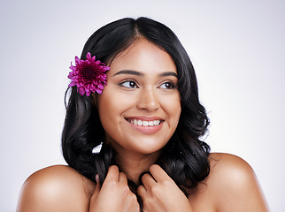 Image showing Beauty, smile and face of happy woman with flower in hair, natural makeup and salon treatment on white background. Nature, hairstyle and flowers, face of latino model with haircare on studio backdrop