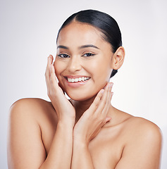 Image showing Natural, beauty and woman with hands on face in studio for glow, dermatology or cosmetics. Portrait of a happy aesthetic model person with self care, facial or skincare results on a white background