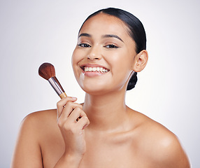 Image showing Makeup brush, woman with smile in portrait and beauty, foundation and powder isolated on studio background. Female model, face with natural cosmetics and skin glow with cosmetic tools and cosmetology