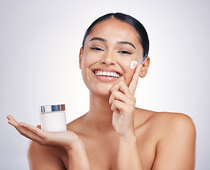 Image showing Happy woman, portrait and cream product in skincare, moisturizer or cosmetics against a white studio background. Female person or model smiling for cosmetic lotion or facial treatment on mockup space