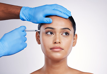 Image showing Facial injection, beauty and skincare with woman, cosmetic treatment and filler isolated on studio background. Doctor hands, needle and female model face with dermatology, cosmetics and skin facelift