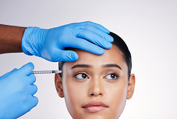 Image showing Woman, studio and injection with hands, surgery or worry with thinking, doubt or collagen by white background. Girl cosmetic surgeon and filler with idea, pain or fear for beauty, skincare or change