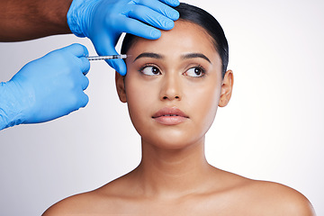 Image showing Face injection, beauty and skincare with woman, cosmetic treatment and fillers isolated on studio background. Doctor hands, needle and female model with dermatology, cosmetics and skin facelift