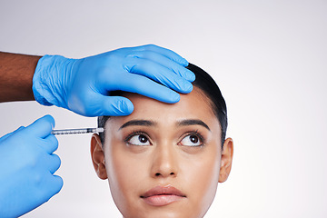 Image showing Woman, studio and needle with hands, surgery or worry with thinking, doubt or collagen by white background. Girl cosmetic surgeon and filler with ideas, mistake or fear for beauty, skincare or change