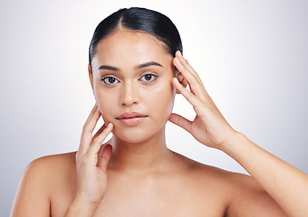 Image showing Beauty, skin and woman with hands on face in studio for glow, dermatology or natural cosmetics. Portrait of aesthetic model person with self care, facial or skincare results on a white background