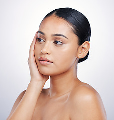 Image showing Beauty, natural and face of a woman in studio for skin glow, dermatology or cosmetics. Headshot of aesthetic model person thinking of self care, facial or skincare benefits on a white background