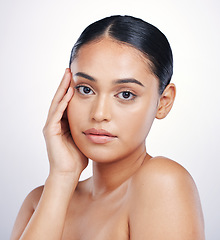 Image showing Skin, beauty and face portrait of a woman in studio for glow, dermatology or natural cosmetics. Headshot of an aesthetic model person with self care, facial or skincare results on a white background