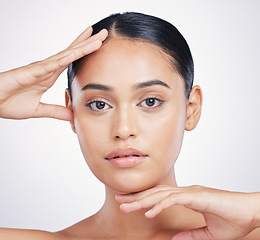 Image showing Natural, beauty and woman with hands on face in studio for skin dermatology and cosmetics. Portrait of aesthetic model person from Portugal for facial self care or skincare glow on a white background