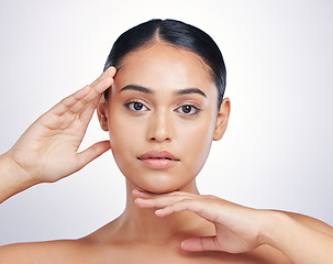 Image showing Beauty, natural and woman with hands on face in studio for skin glow, dermatology or cosmetics. Portrait of aesthetic model person from Portugal for facial self care or skincare on a white background