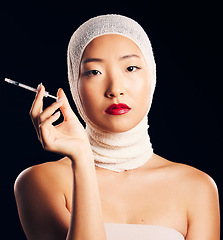 Image showing Woman, portrait and plastic surgery with syringe, bandage and studio background with asian beauty for filler. Female person, face and cosmetology with injection for skin, collagen and treatment.