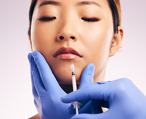 Image showing Lips injection, skincare and woman with plastic surgery in studio isolated on a white background. Cosmetics, syringe and female model with lip filler for dermatology, facelift treatment and beauty.