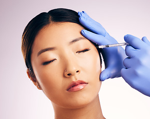 Image showing Face injection, skincare and woman with plastic surgery in studio isolated on a white background. Cosmetics, syringe and female model with dermal filler for dermatology, facelift treatment and beauty