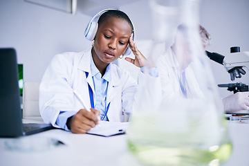 Image showing Science, tired and black woman with a headache, writing or burnout with health issue, overworked and fatigue. Female person, employee or scientist with a migraine, stress or overtime with frustration