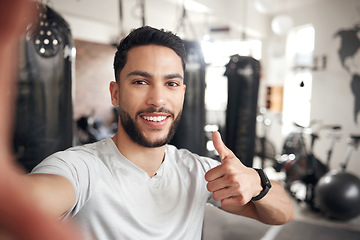 Image showing Man, portrait and selfie at a gym for fitness with thumbs up for wellness or health in a close up. Male person, selfies and workout with happiness for training or exercise at a club for video call.