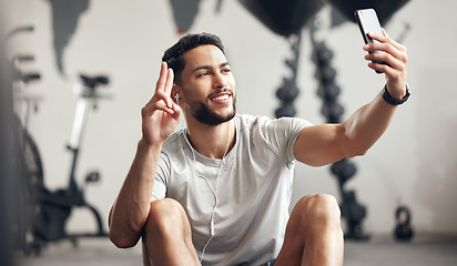 Image showing Man, gym and selfie with happiness for exercise with motivation and wellness with peace sign. Male person, training and video call for a workout for sports and conversation with smile at a club.