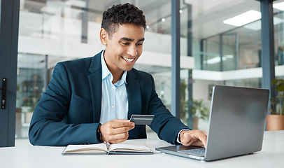 Image showing Credit card, business man and laptop with online banking, payment and ecommerce store. Office, male professional and smile of a corporate worker with web shopping on an internet retail shop at work