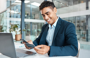 Image showing Credit card, business man phone and laptop with online banking, payment and ecommerce store. Office, male professional and smile of a corporate worker with web shopping on an internet shop at work