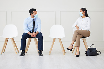 Image showing Face mask, chair and business people waiting for interview, job vacancy and opportunity in office. Corporate, recruitment and man and woman talking, speaking and in conversation for hiring in covid